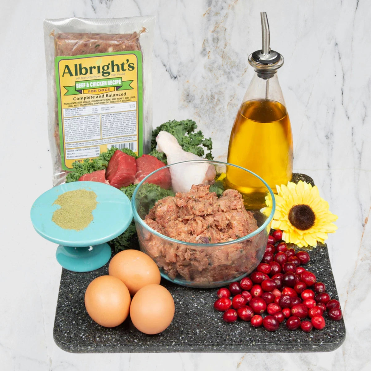 Albright’s Beef and Chicken Complete and Balanced Raw Dog Food shown in bowl with packaged pouch, sold by Benny’s Raw Dog Food
