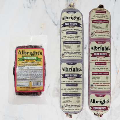 Albright’s Beef and Pork Complete and Balanced Raw Dog Food packaging including tubes and brick, sold by Benny’s Raw Dog Food