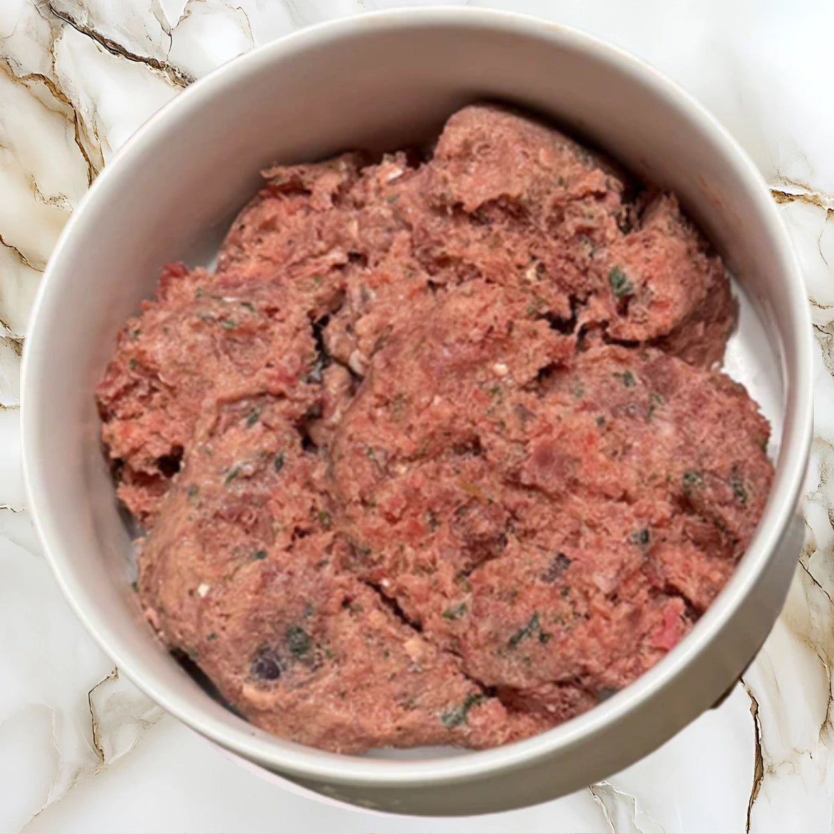 Bowl of Albright’s Chicken Complete and Balanced raw dog food made with chicken, organs, and whole-food ingredients
