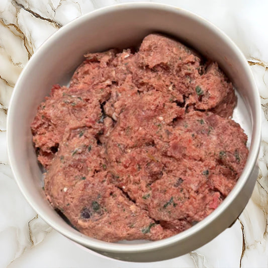 Bowl of Albright’s Chicken Complete and Balanced raw dog food made with chicken, organs, and whole-food ingredients
