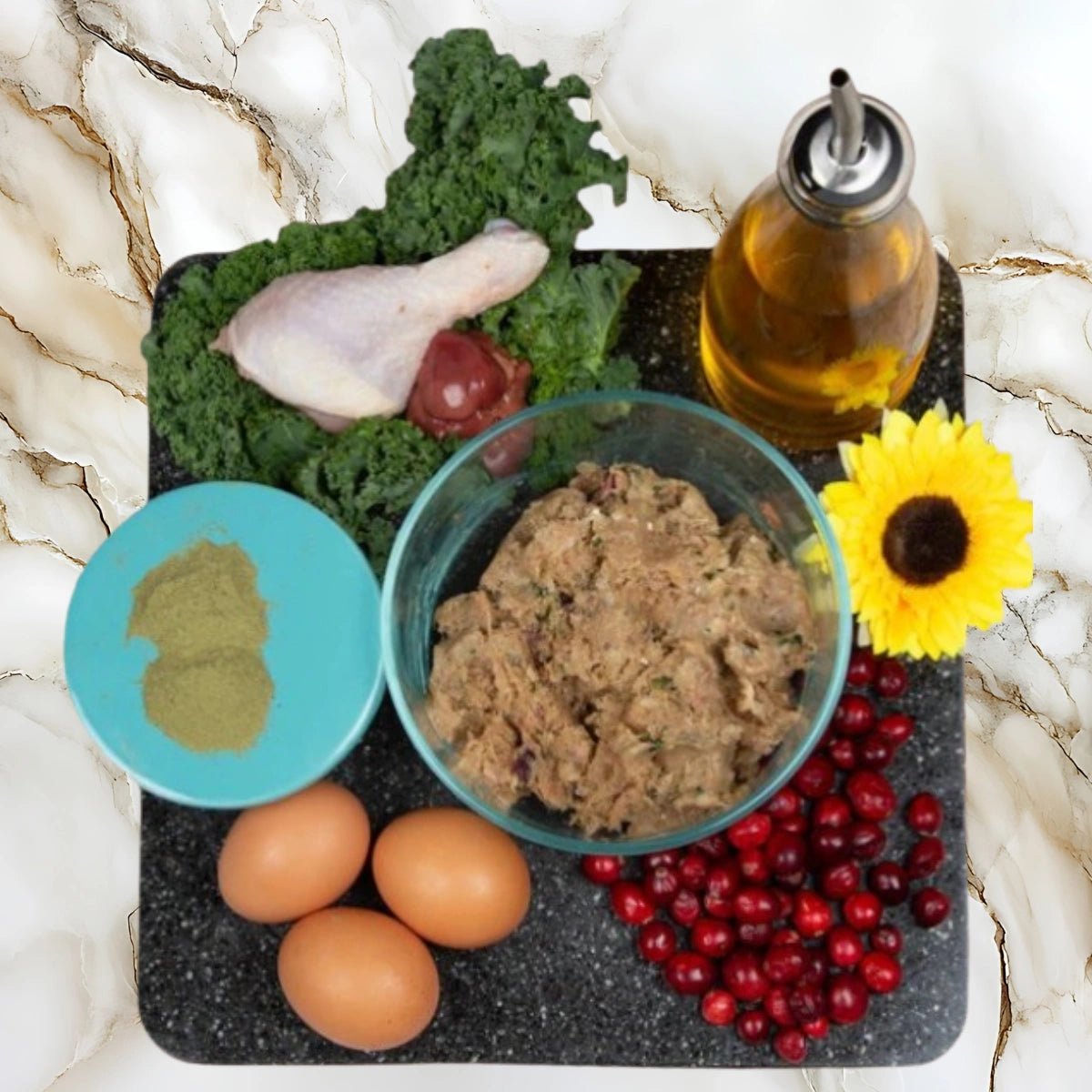 Ingredients used in Albright’s Chicken Complete and Balanced raw dog food including chicken, eggs, kale, cranberries, and healthy fats
