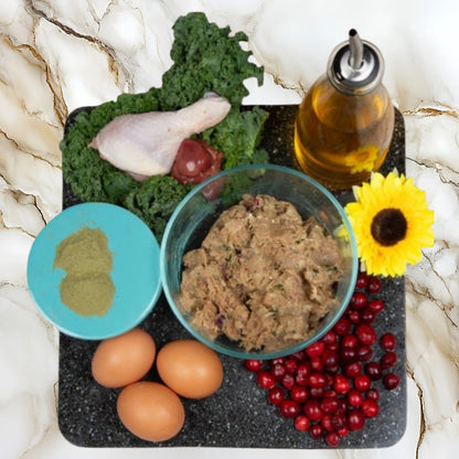 Ingredients used in Albright’s Chicken Complete and Balanced raw dog food including chicken, eggs, kale, cranberries, and healthy fats
