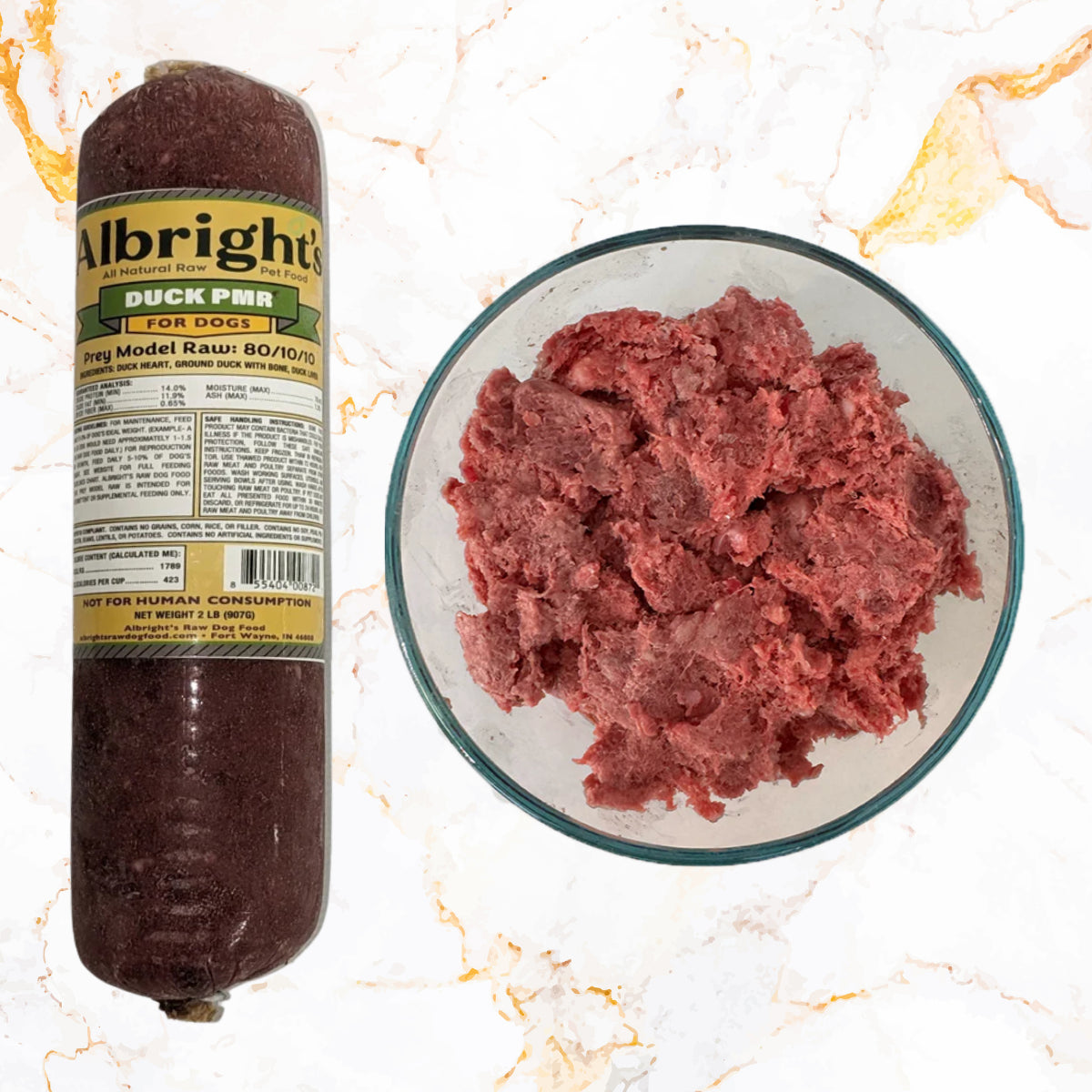 Albright’s Duck Prey Model Raw dog food labeled 80/10/10, shown in a frozen tube and in a bowl, sold by Benny’s Raw Dog Food