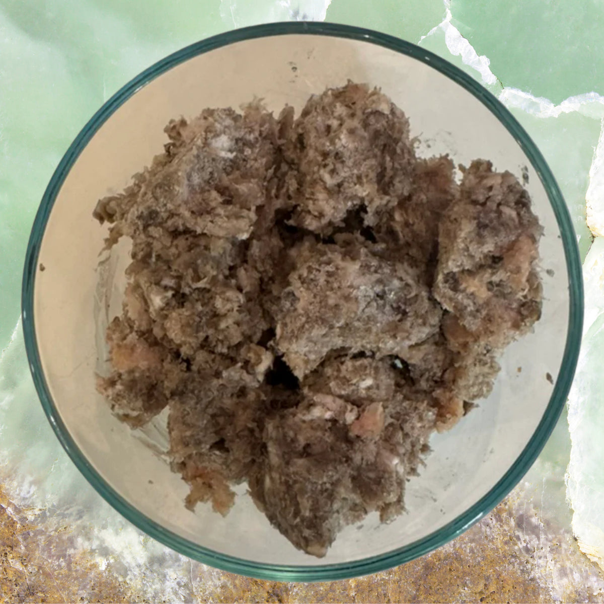 Bowl of raw green lamb tripe dog food showing natural chunky texture, sold by Benny’s Raw Dog Food