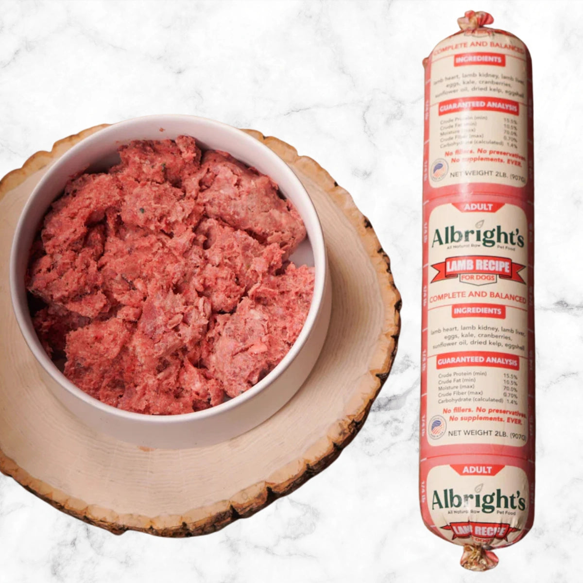 Albright’s Lamb Complete and Balanced Raw Dog Food shown in a bowl with packaged chub, sold by Benny’s Raw Dog Food
