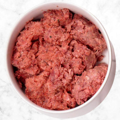 Albright’s Lamb Complete and Balanced Raw Dog Food served in a bowl, sold by Benny’s Raw Dog Food
