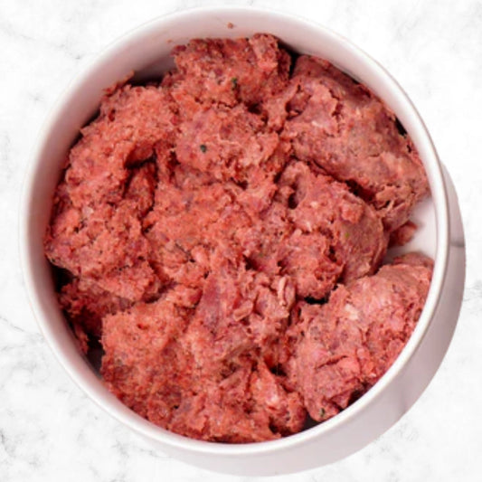 Albright’s Lamb Complete and Balanced Raw Dog Food served in a bowl, sold by Benny’s Raw Dog Food

