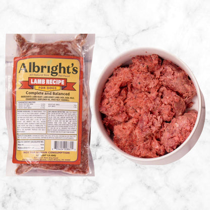 Albright’s Lamb Complete and Balanced Raw Dog Food package with prepared bowl, sold by Benny’s Raw Dog Food
