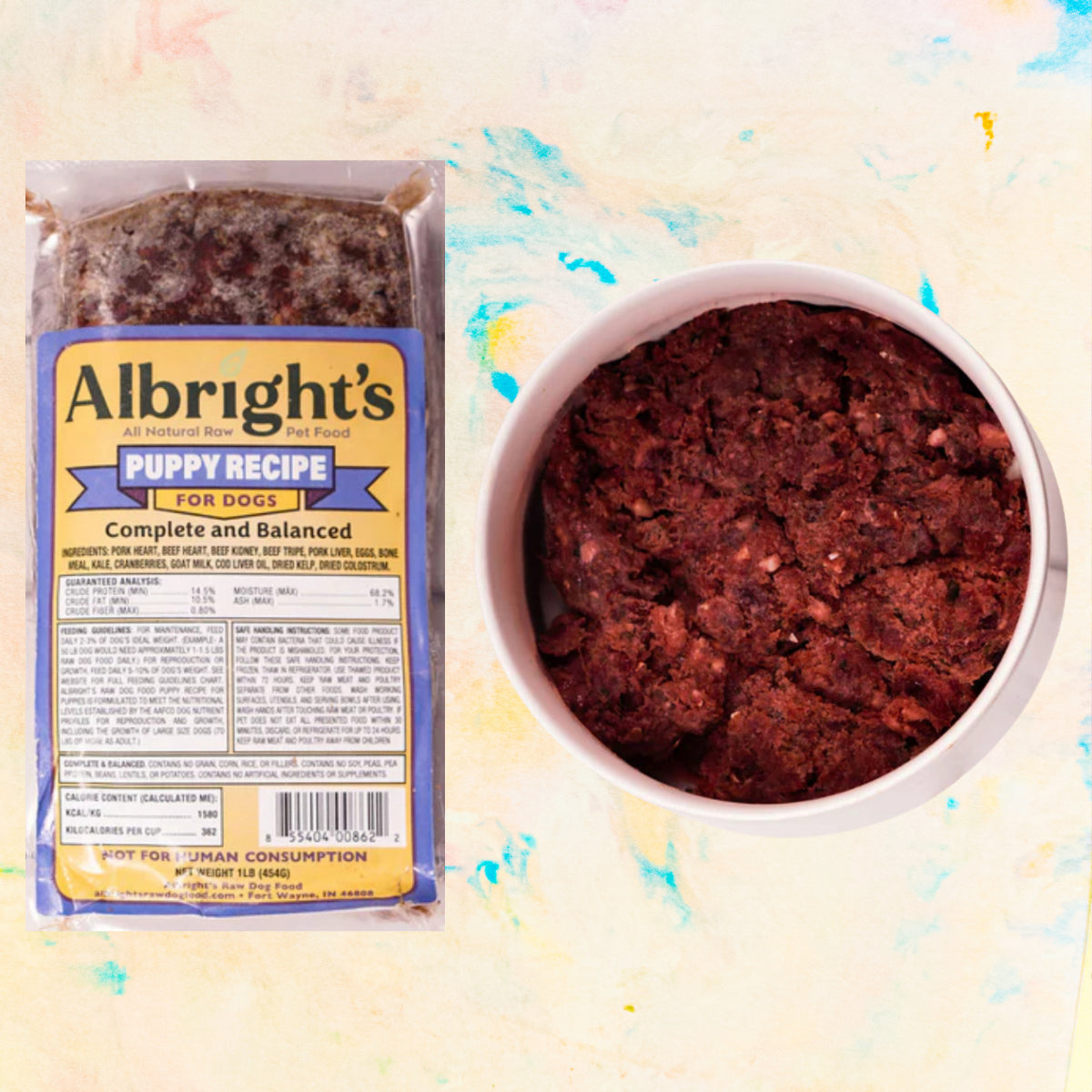 Albright's Puppy Recipe dog food package and bowl of food on a colorful background