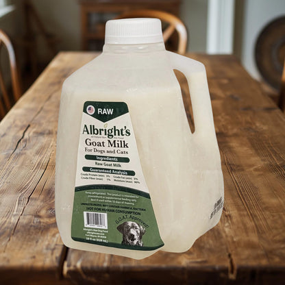 Albright’s Raw Goat Milk for Dogs 32 oz bottle on rustic farm table – Benny’s Raw Dog Food
