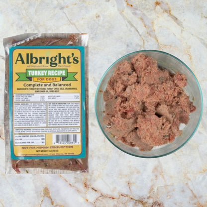 Packaged Albright’s Turkey Complete and Balanced Raw Dog Food with serving bowl, sold by Benny’s Raw Dog Food